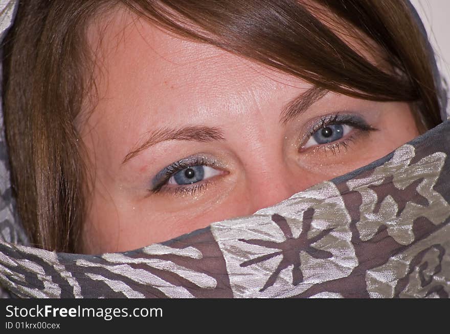 Young Woman s Closeup Blue Eyes with Gray Scarf