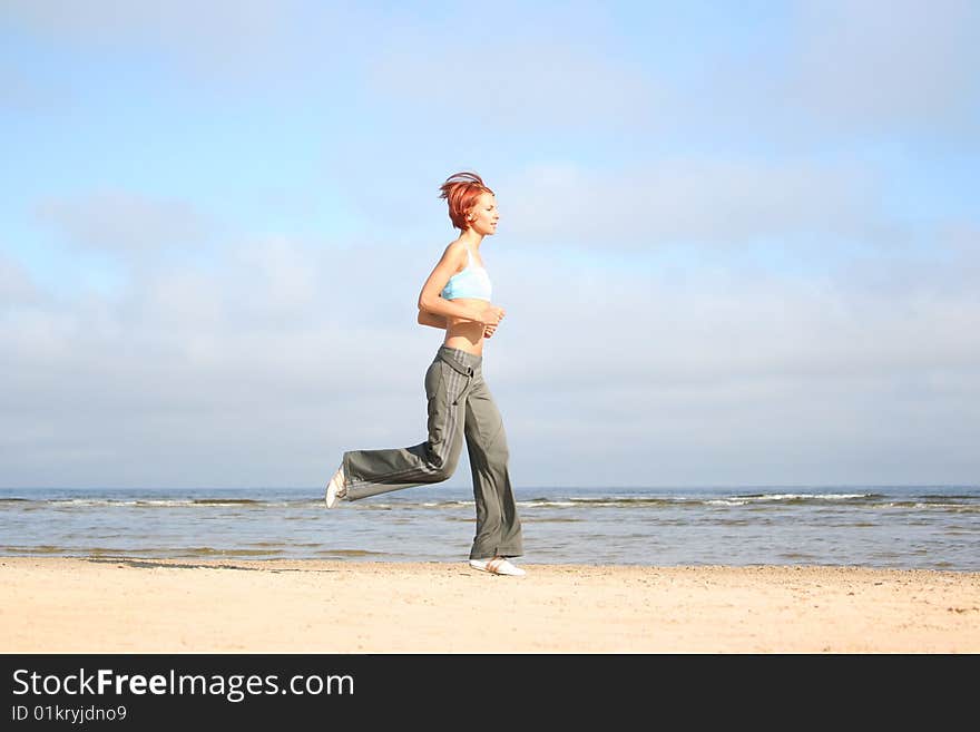 Young girl running on the beach. Young girl running on the beach