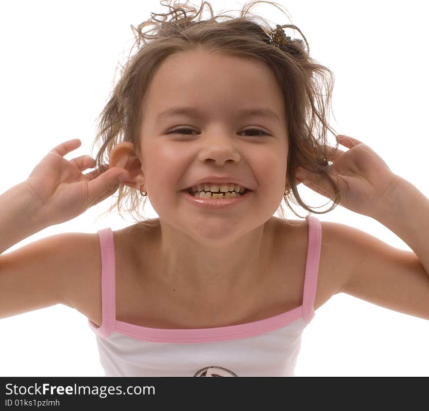 Little girl holding hands over ears and laughing. Little girl holding hands over ears and laughing