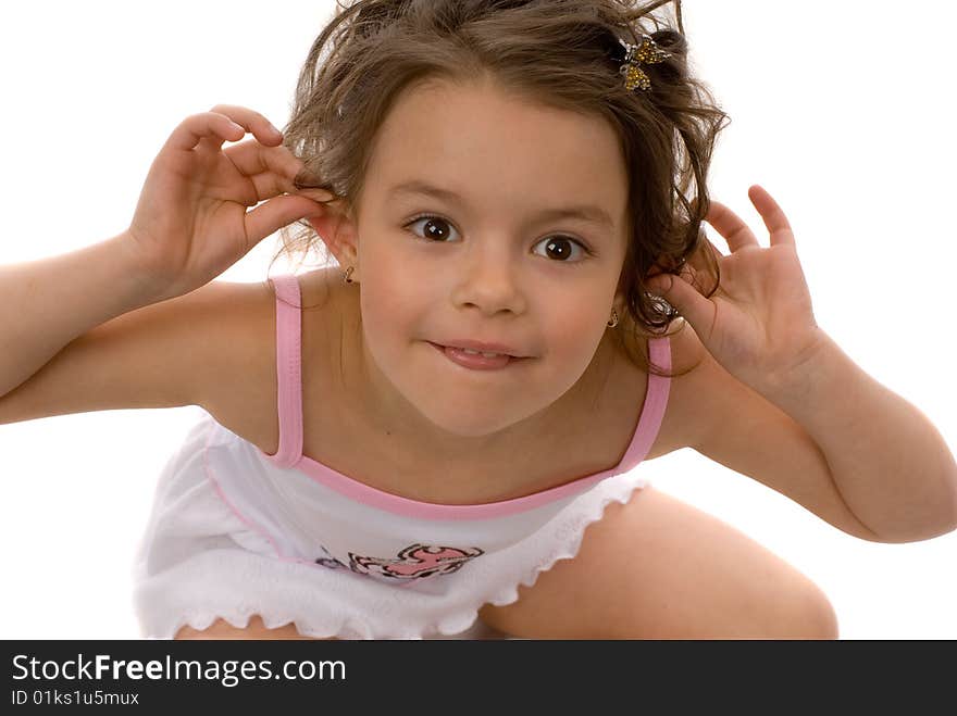 Little girl holding hands over ears and laughing. Little girl holding hands over ears and laughing