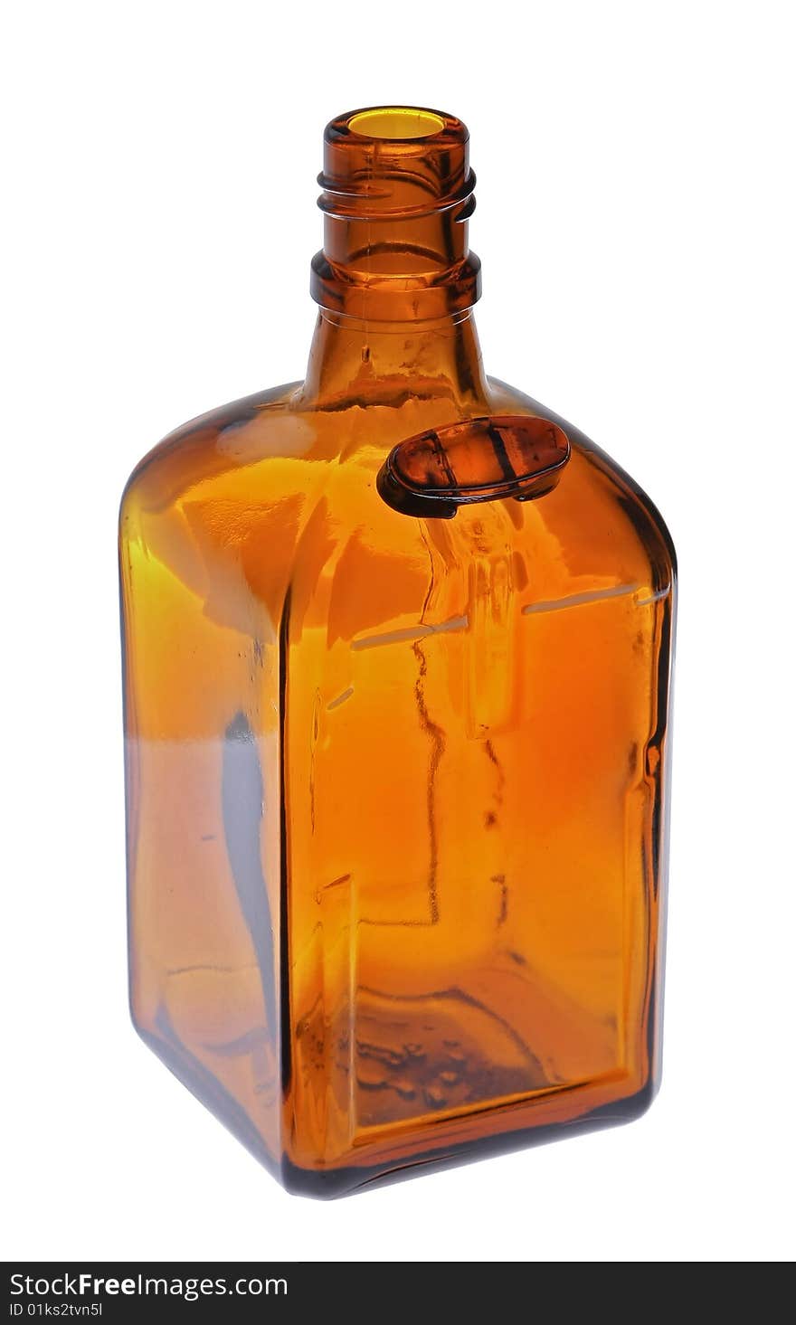 Brown glass cut bottle on the white. Brown glass cut bottle on the white