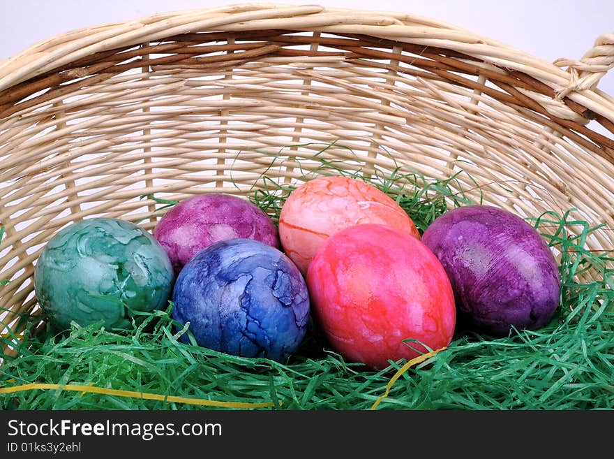 Colorful Easter eggs in one basket