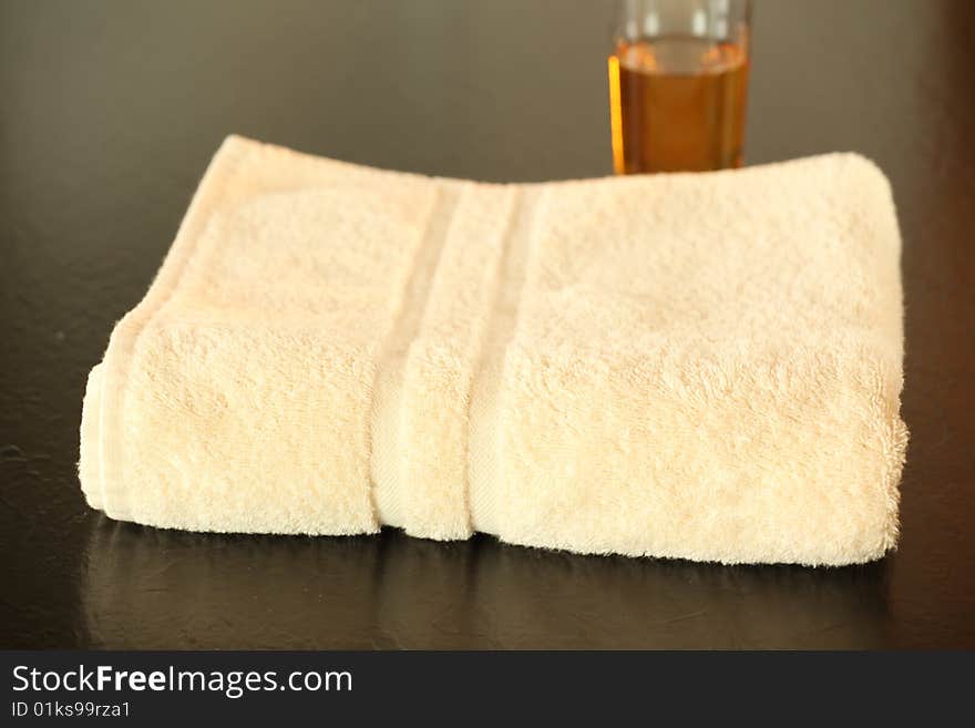 Towel and Bathproduct arranged in still life natural light. Towel and Bathproduct arranged in still life natural light