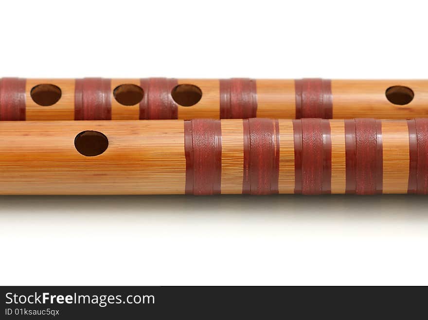 A dizi (Chinese transverse flute) isolated on white background. A dizi (Chinese transverse flute) isolated on white background.