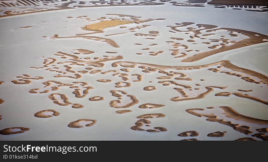 Oyster beds exposed during near low tide in estuary along the South Carolina Atlantic coast