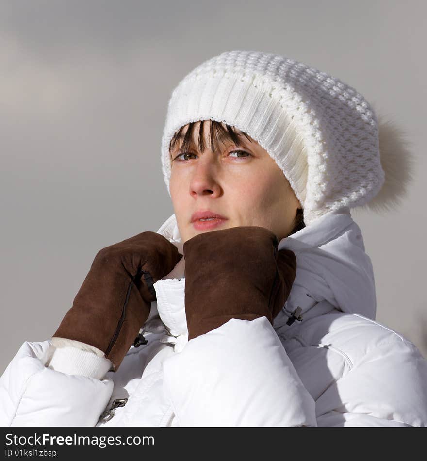 Winter portrait of a serious girl in leather gloves. Winter portrait of a serious girl in leather gloves