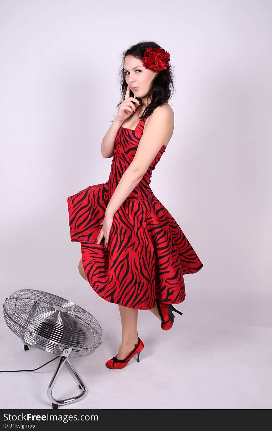 A pinup girl standing near ventilator