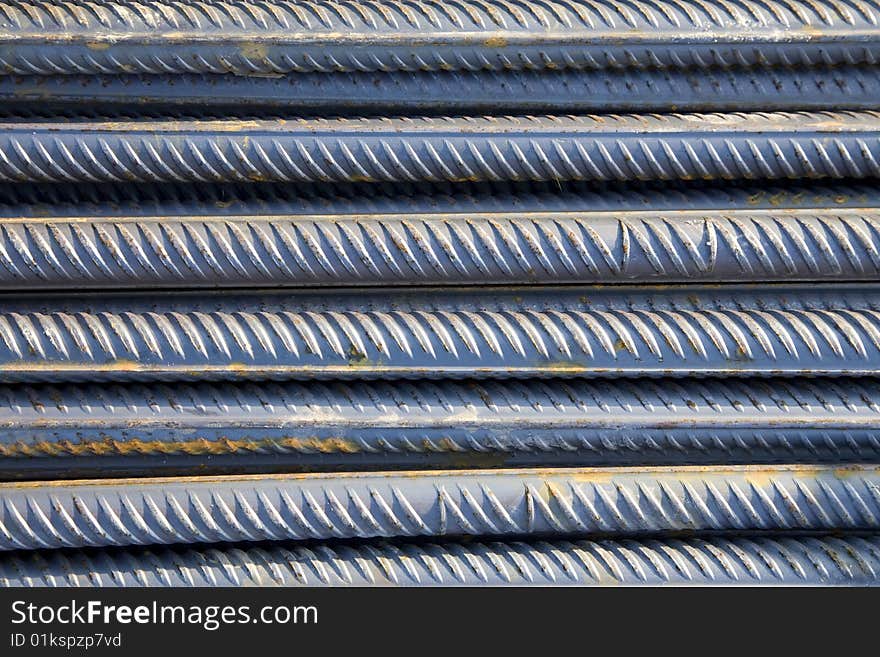 Stack of metal rods as an industrial background design