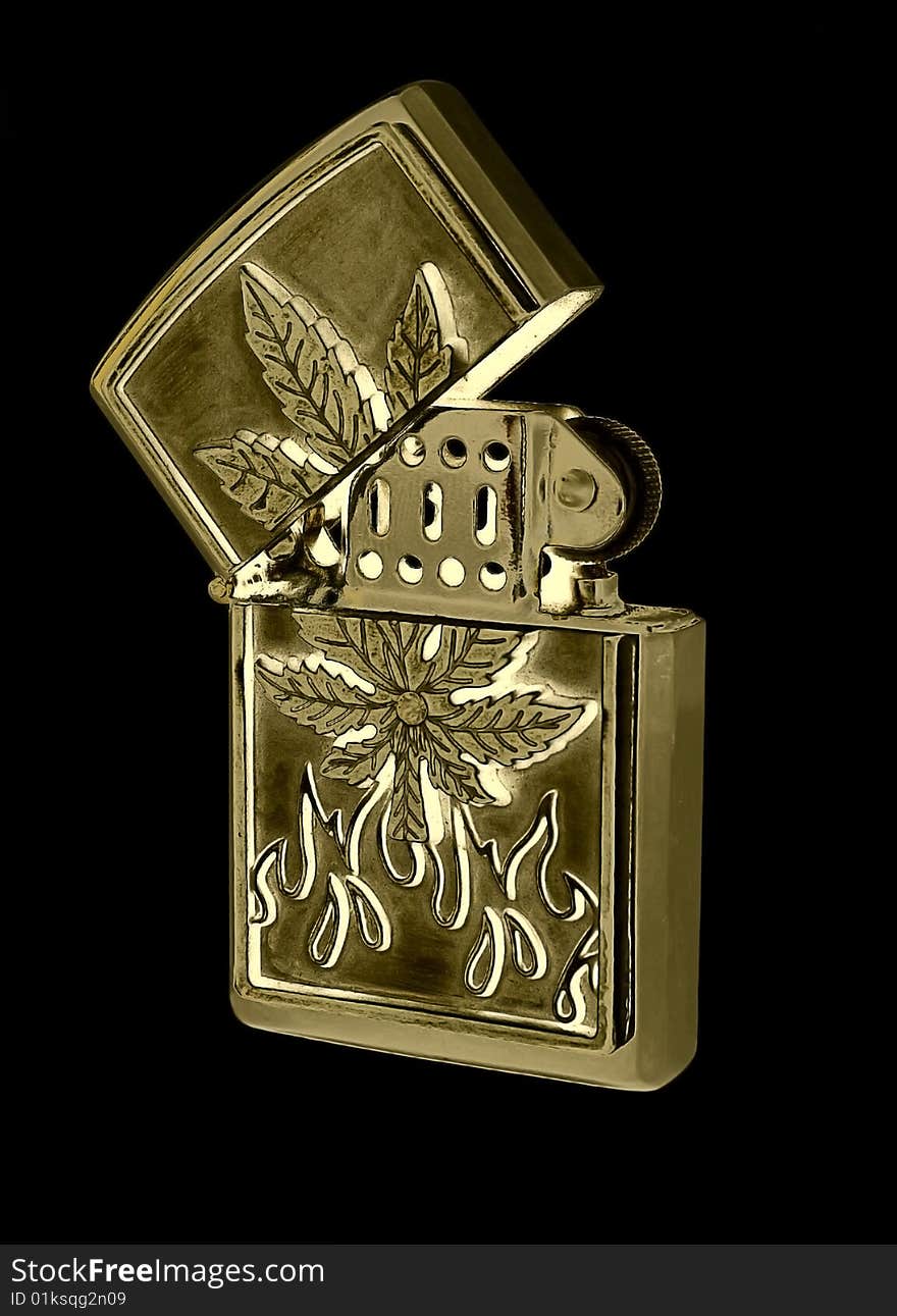 Beautiful gold petrol lighter on a black background