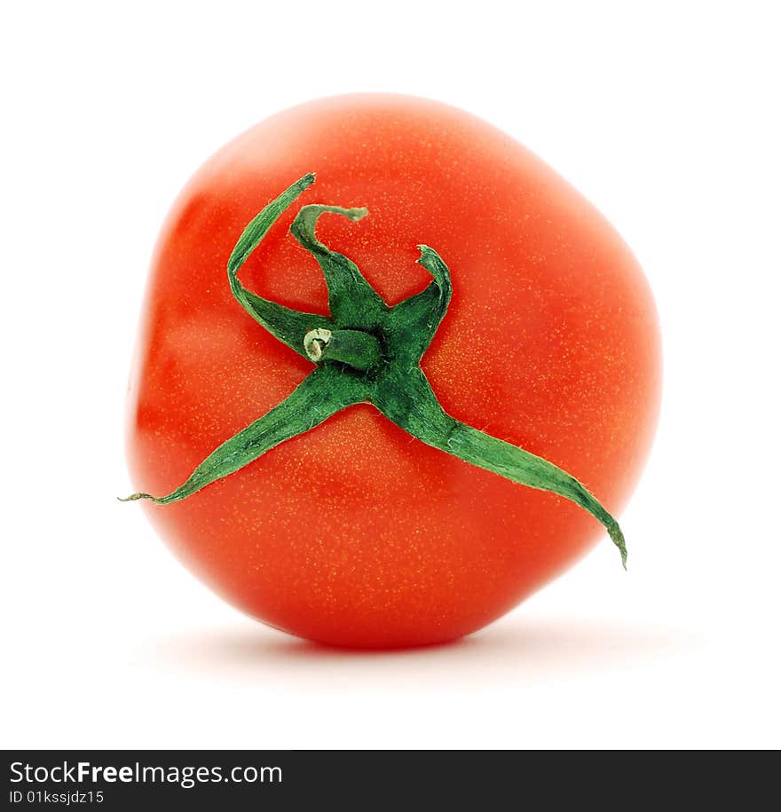 Ripe big red tomato on a white background