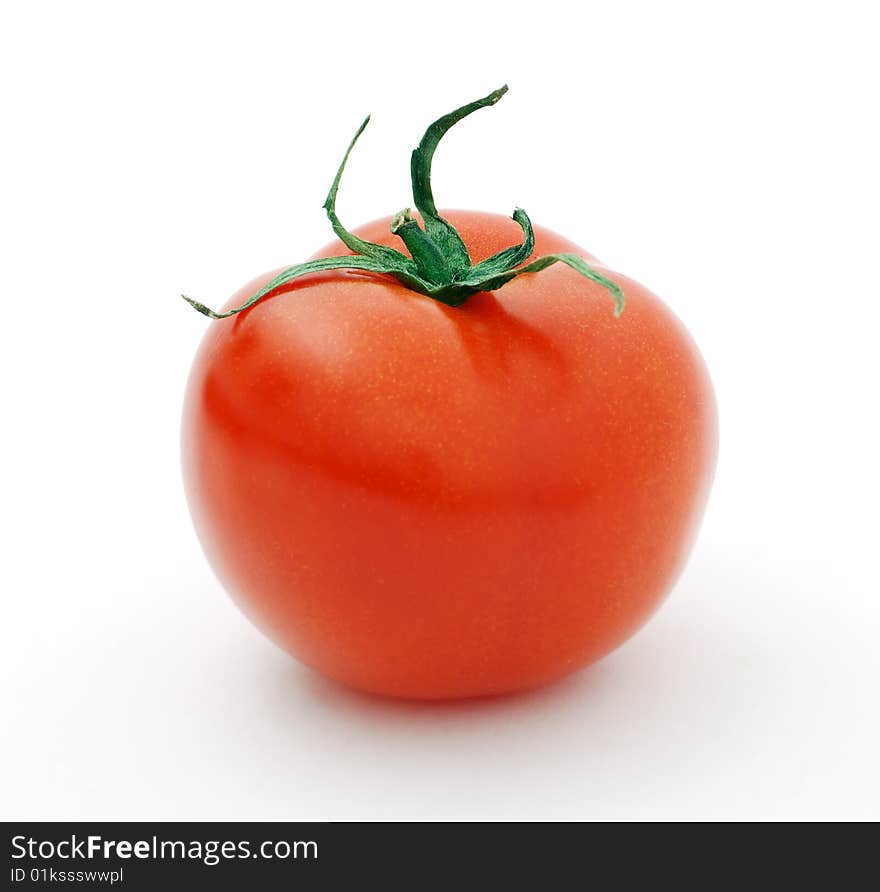 Ripe big red tomato on a white background