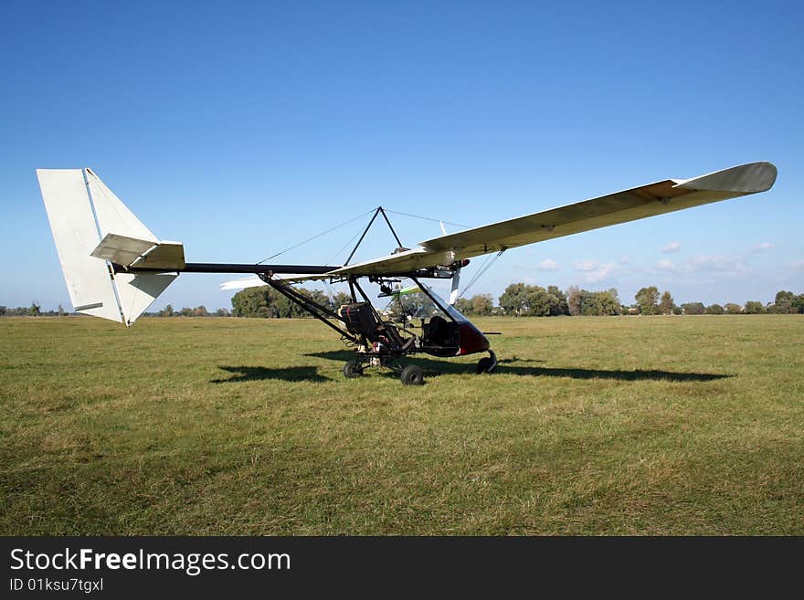 White microlight after landing on the field. White microlight after landing on the field