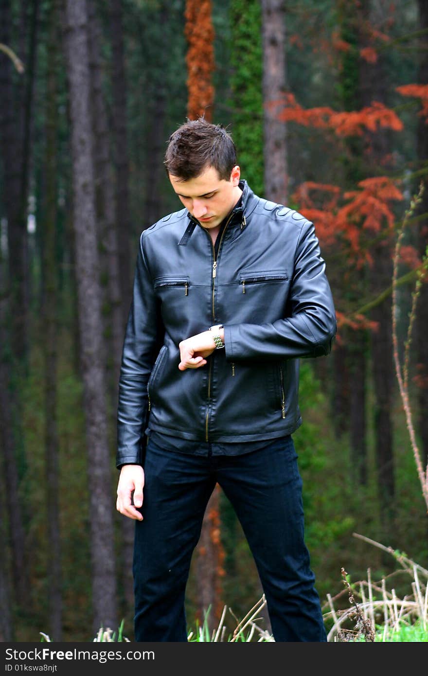 Young Businessman and Watch, shot outdoors.