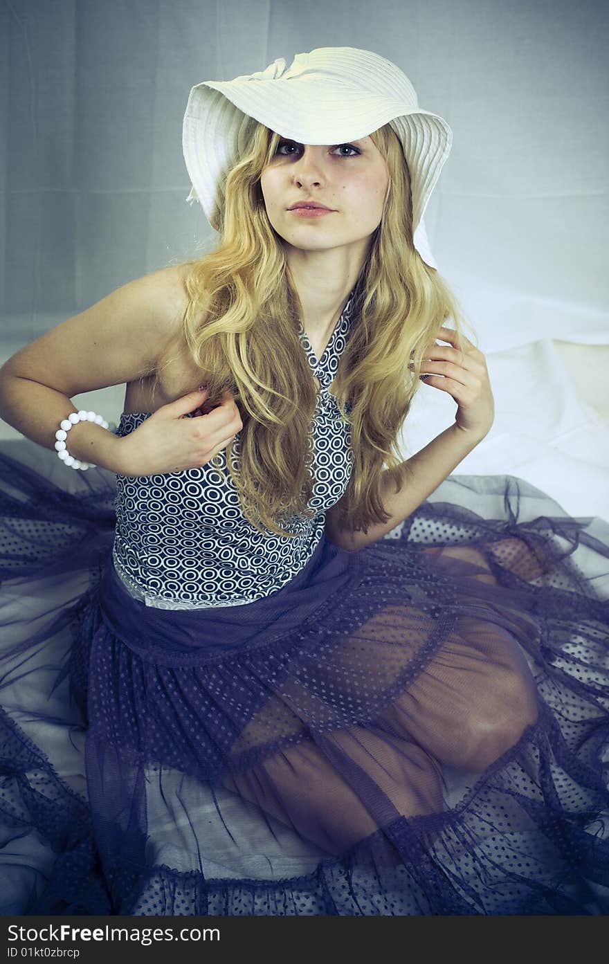 Portrait of a young blonde girl in the white background. Portrait of a young blonde girl in the white background