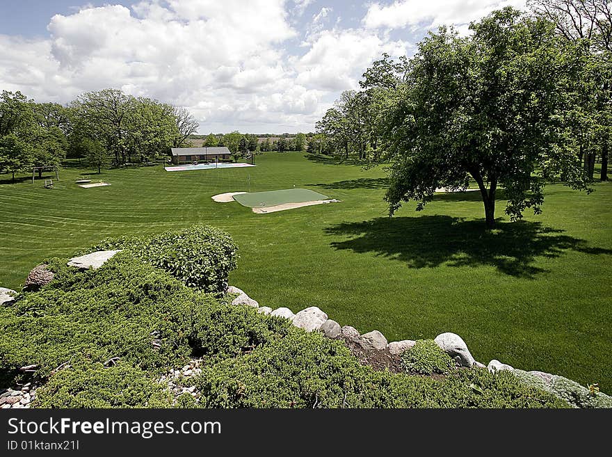 Grounds with putting green and pool