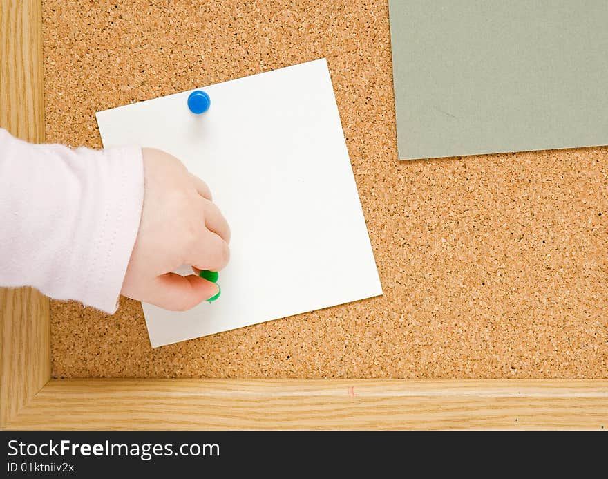 Brown corkboard with important message