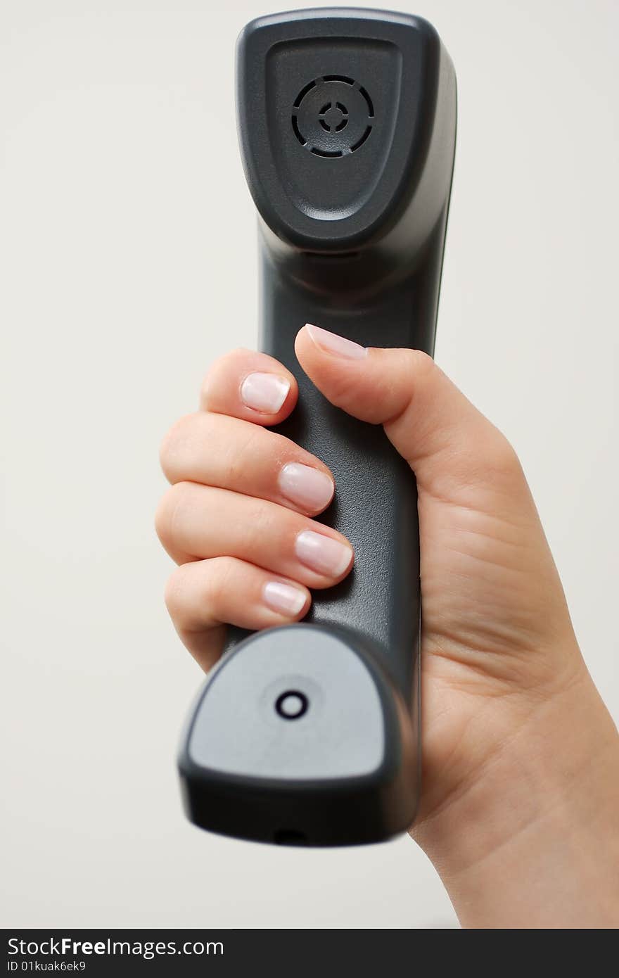 Telphone being held in right female hand