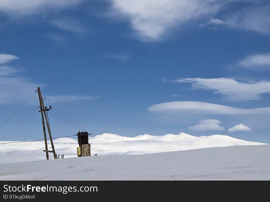 Electric line high power transformer high into the mountains. Electric line high power transformer high into the mountains.