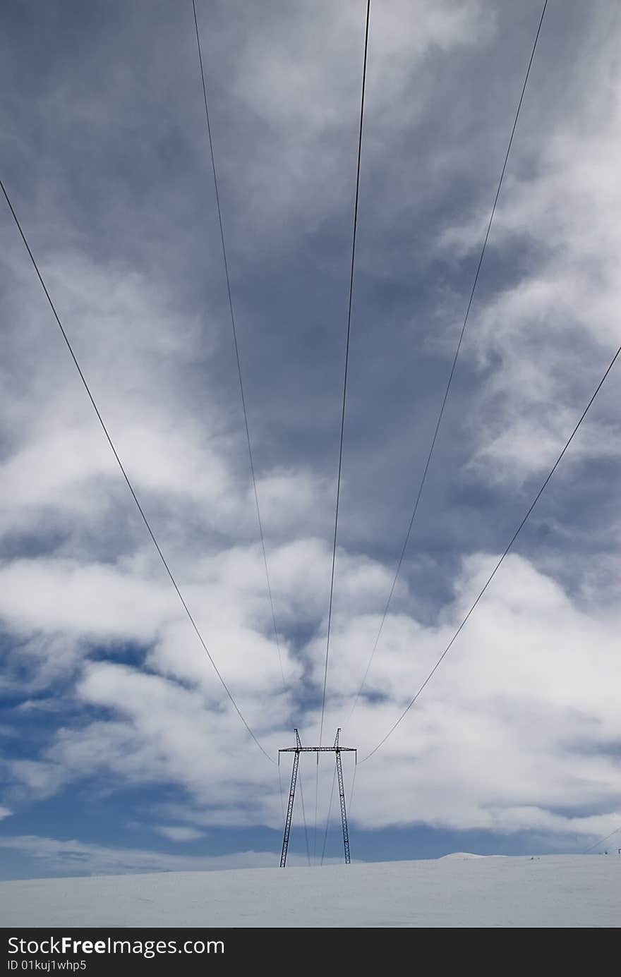 High voltage electric line high into the mountains. High voltage electric line high into the mountains.