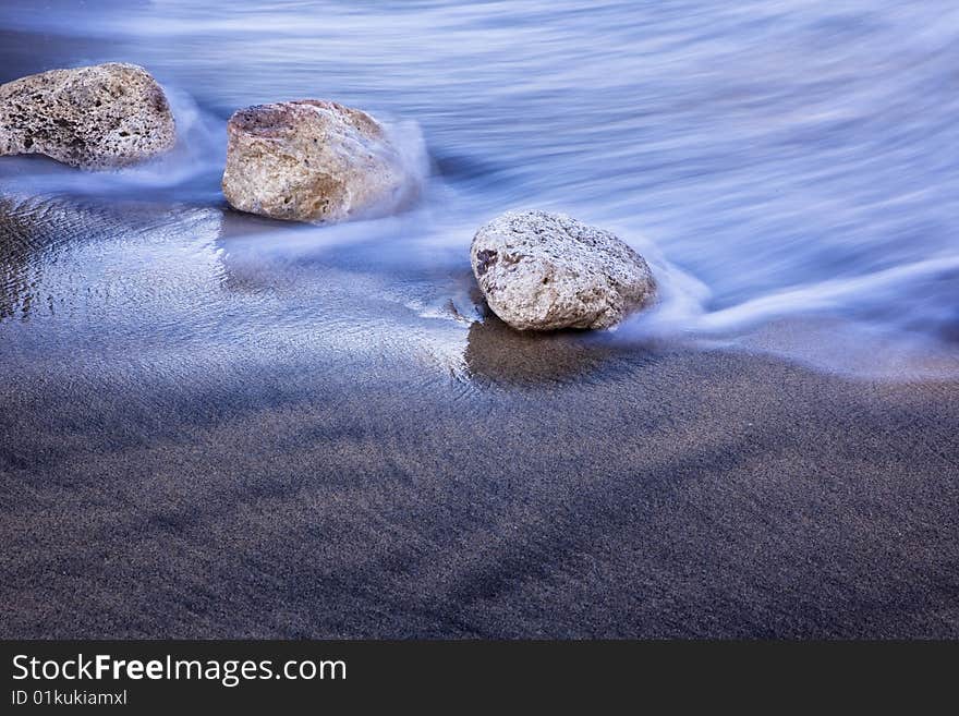 Long exposed wave reaching shore. Long exposed wave reaching shore.