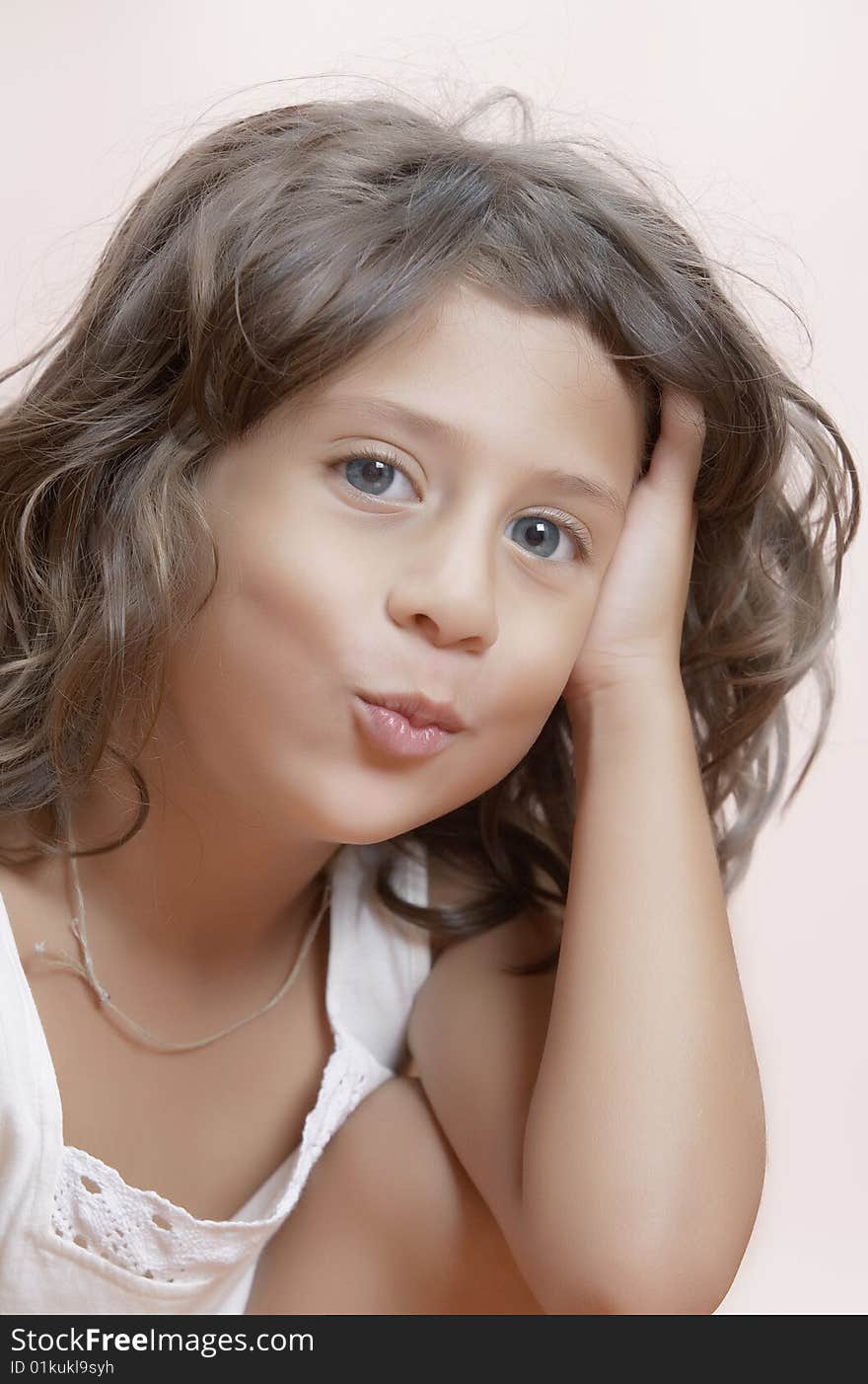 Studio portrait of  nice little girl having good time