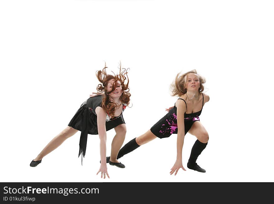 Two girls of the dancer pose in studio