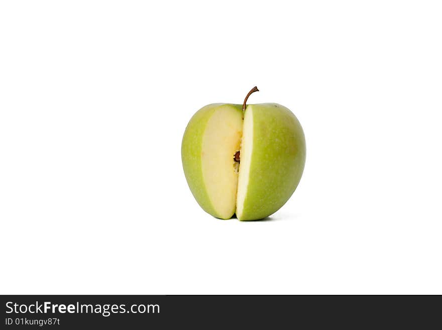 The green cut off apple on a white background