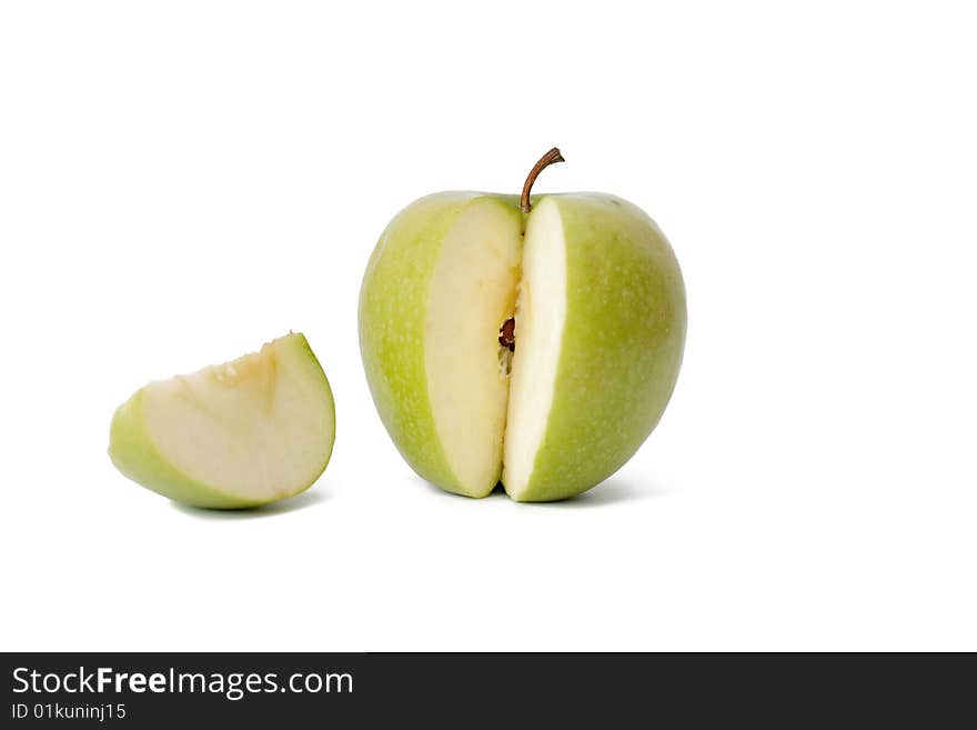 The green cut off apple on a white background