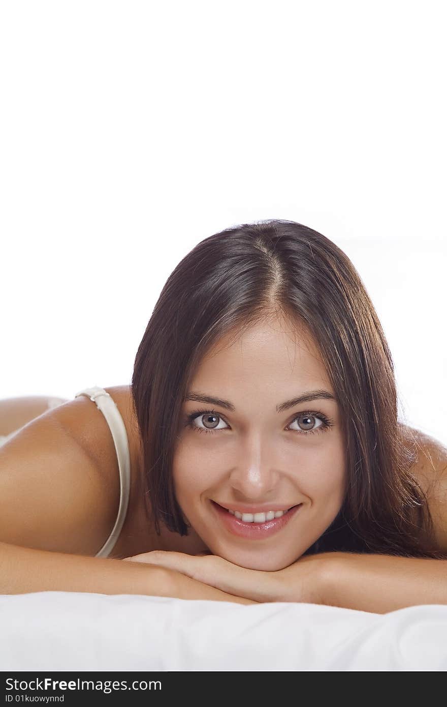 Portrait of young beautiful woman on white sheet. Portrait of young beautiful woman on white sheet