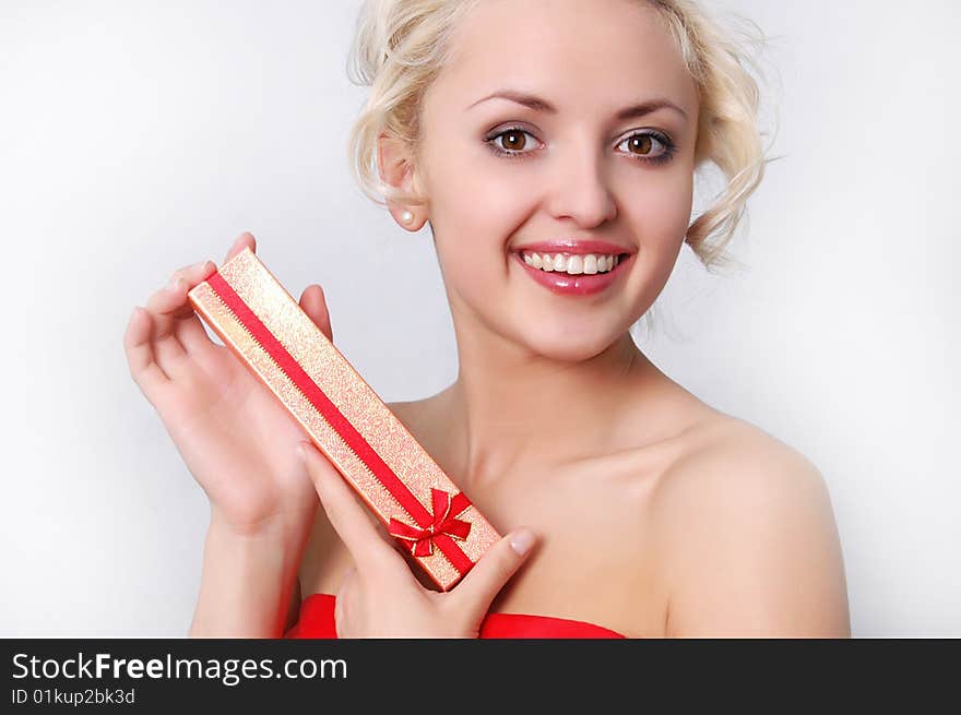 Young blond girl with present close up shoot