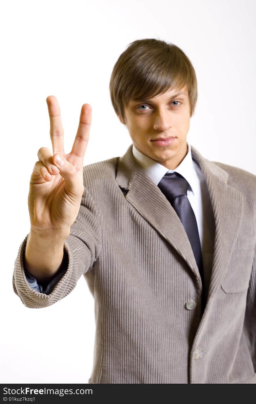 Business man making victory sign. Business man making victory sign