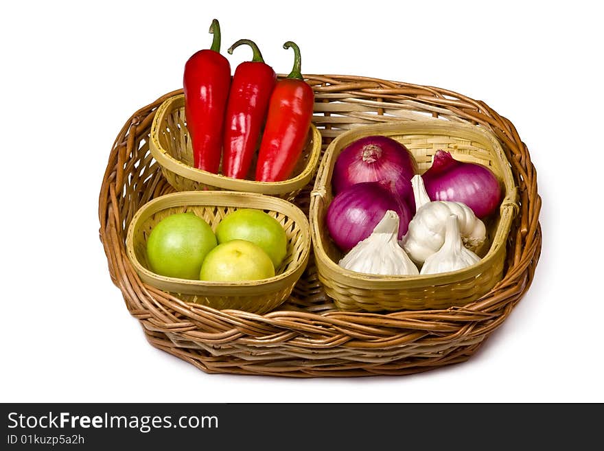 Bamboo basket having chili, lemon, garlic and onion. Bamboo basket having chili, lemon, garlic and onion