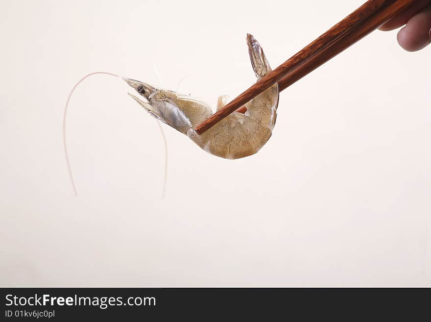 A chopsticks with shrimp