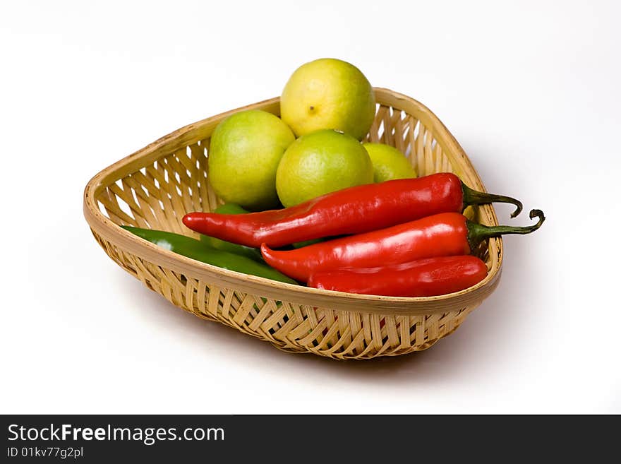 Bamboo basket having chili, lemon, green chili. Bamboo basket having chili, lemon, green chili