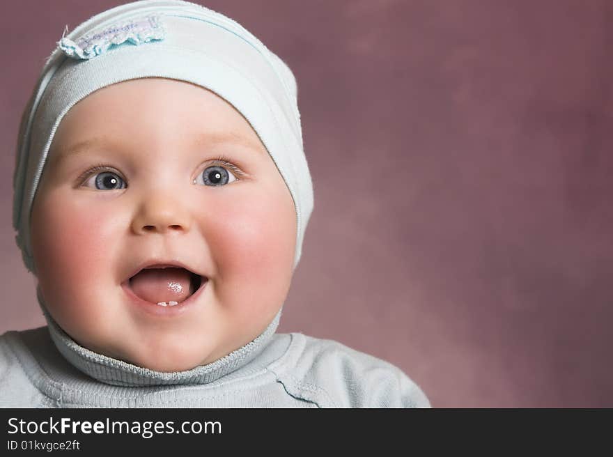 Baby girl with chubby cheeks and beautiful facial expressions