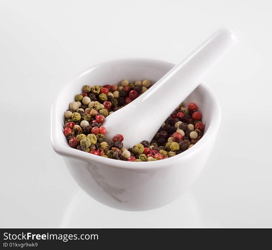 Peppercorns in a porcelain mortar