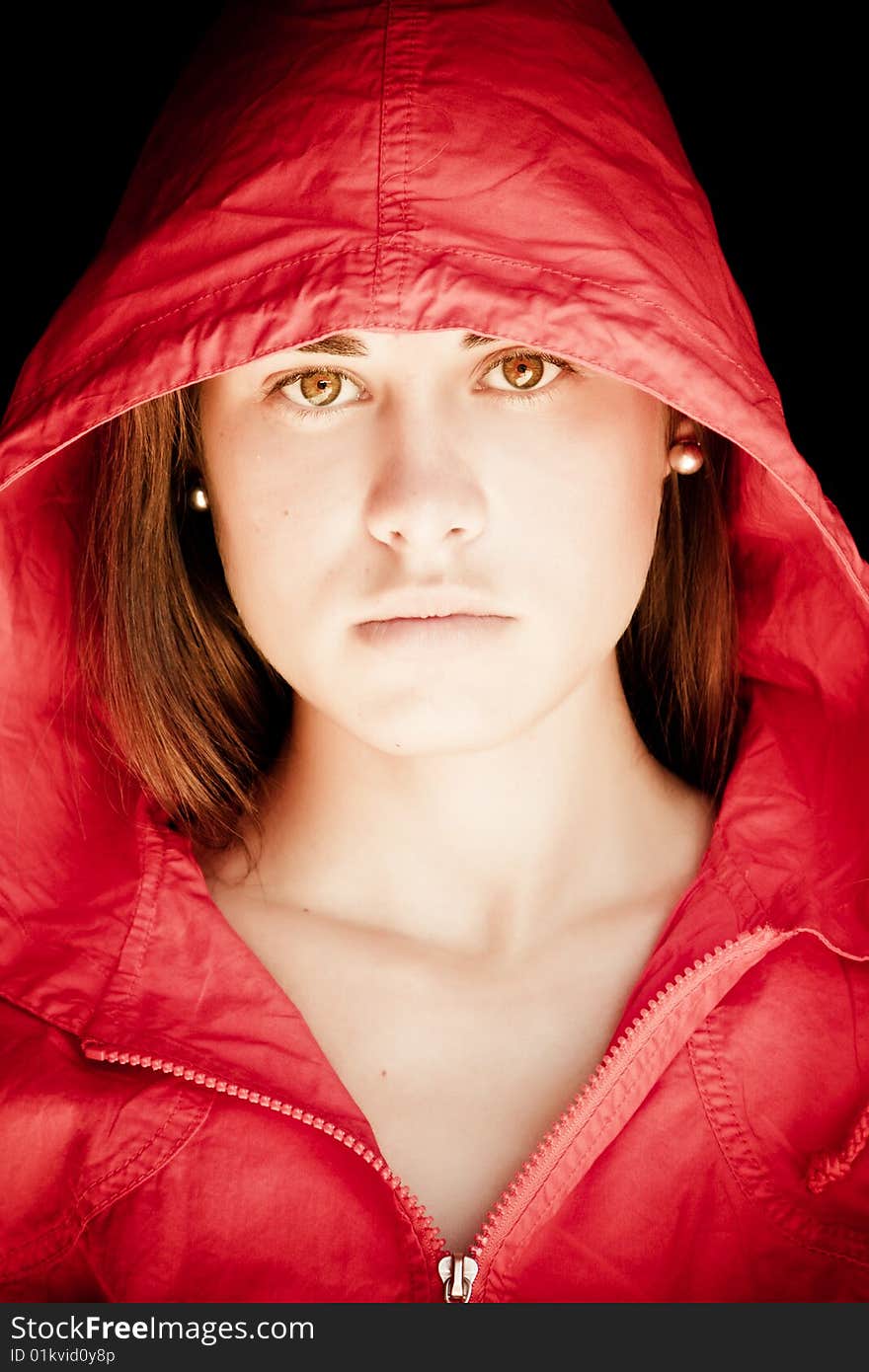 Green eyed beauty protected with a red cap from the dark. Green eyed beauty protected with a red cap from the dark.