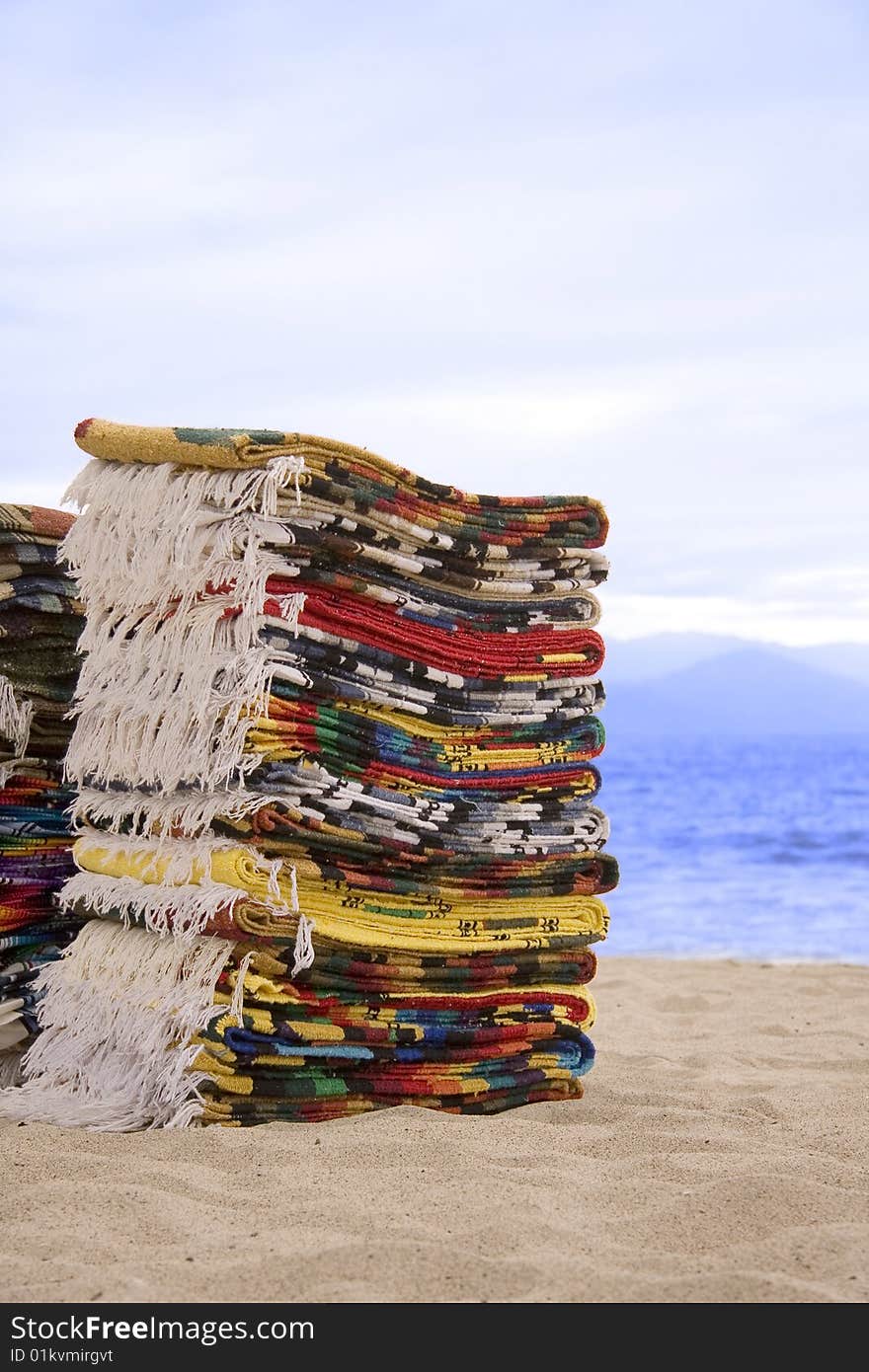 Mexican blankets for sale on the beach.