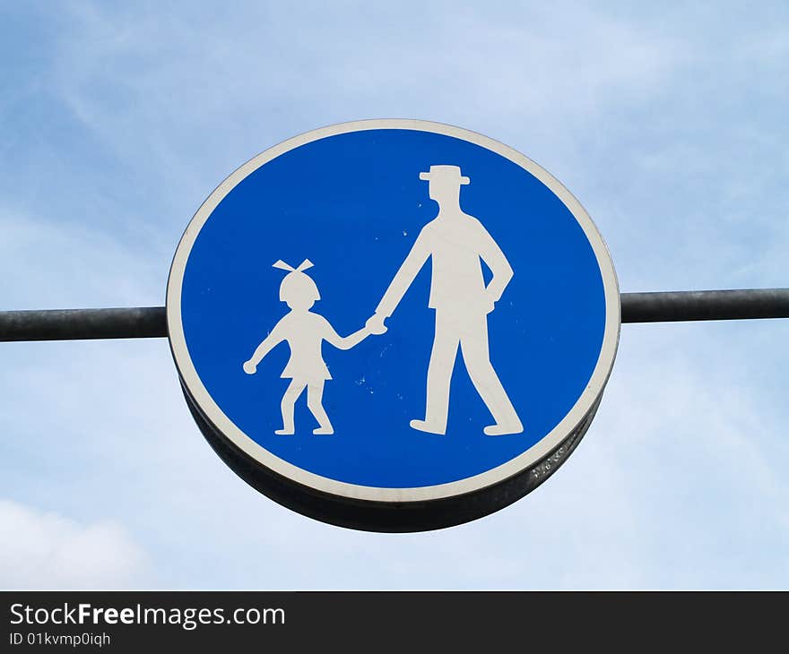 Blue rounded pedestrian path sign