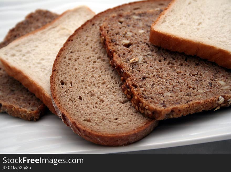 Some different kinds of fresh bread slices