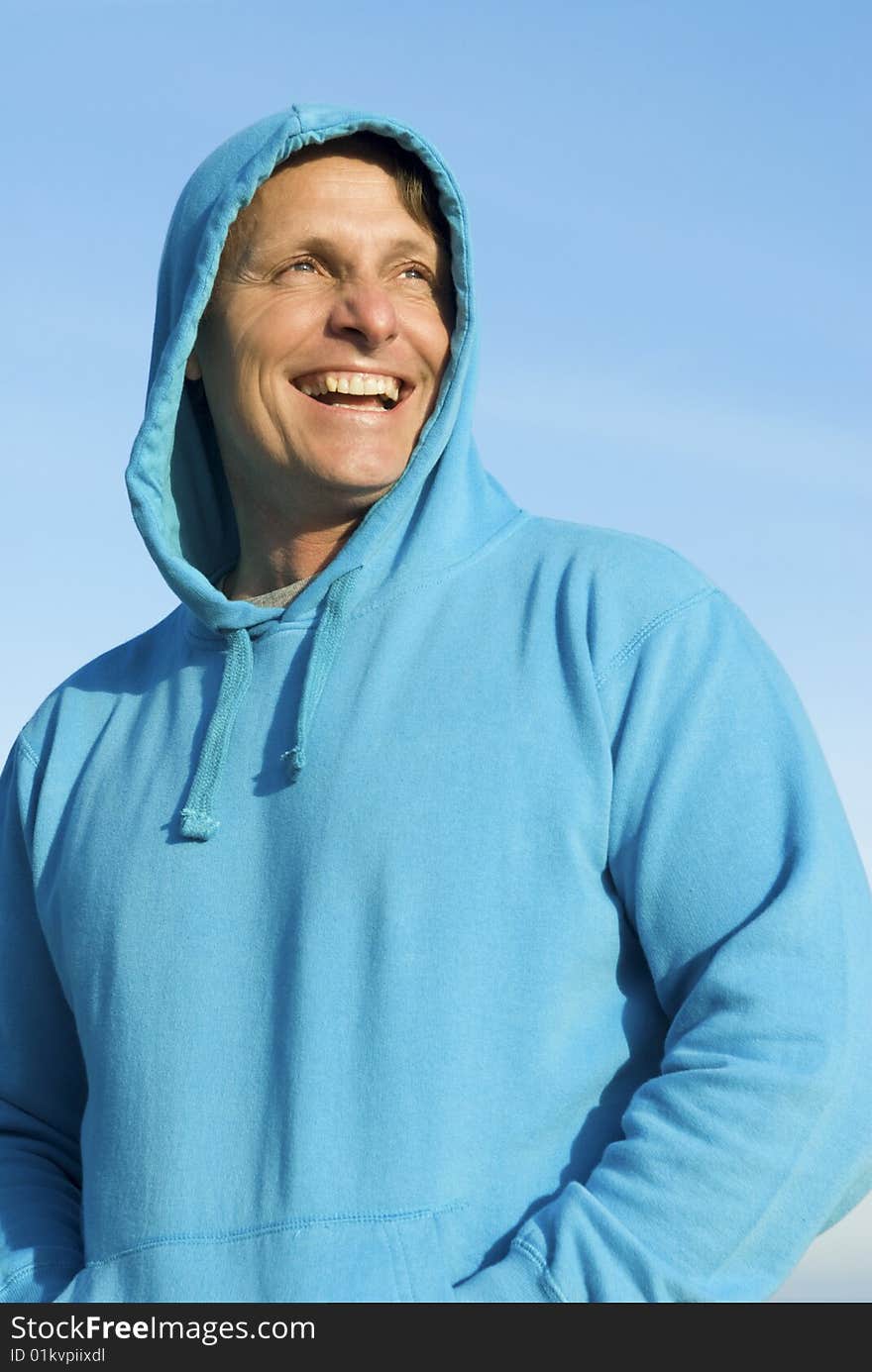 A happy smiling forties man having fun on the beach. A happy smiling forties man having fun on the beach.