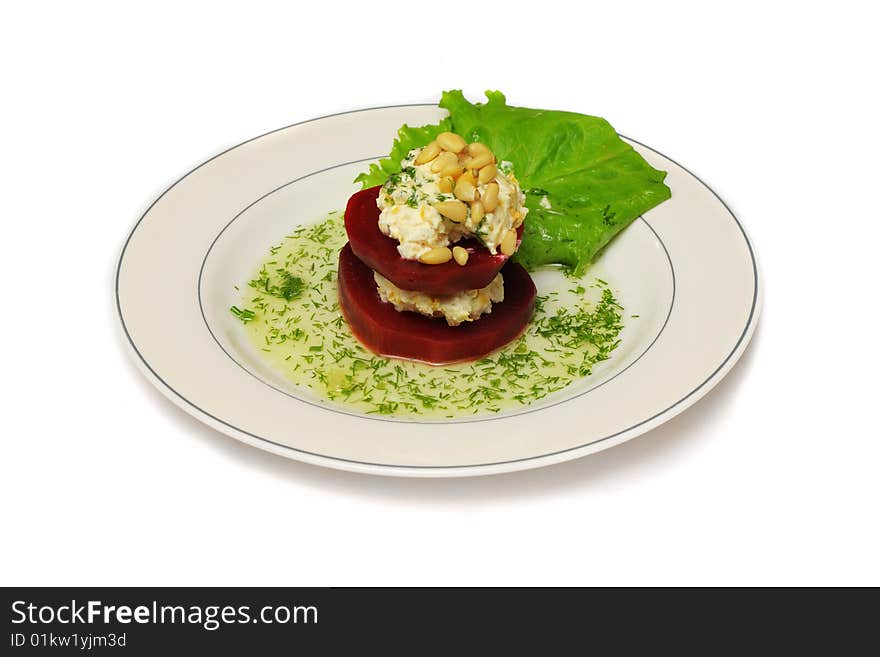 A plate with double-floor beet with salad leaf and sauce