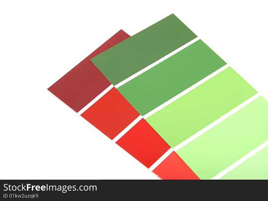 A red and green paint sample on white background. A red and green paint sample on white background.