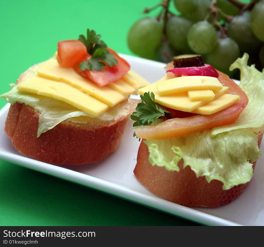 A fresh breakfast with bread, cheese and vegetables