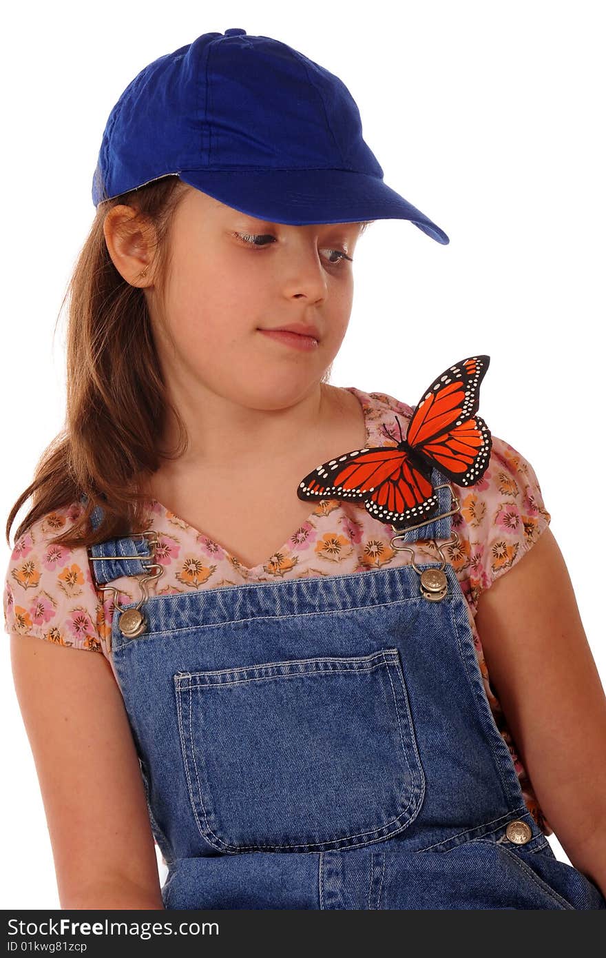 An elementary girl leary of a large Monarch butterfly resting on her shoulder. Isolated on white. An elementary girl leary of a large Monarch butterfly resting on her shoulder. Isolated on white.