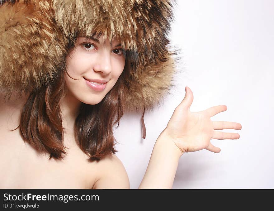 Portrait of the girl in a fur cap.