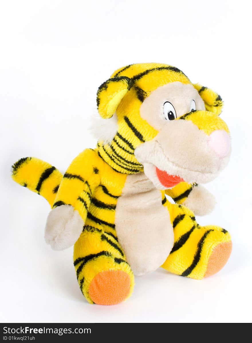 Toy tiger yellow in turn black strip on white background