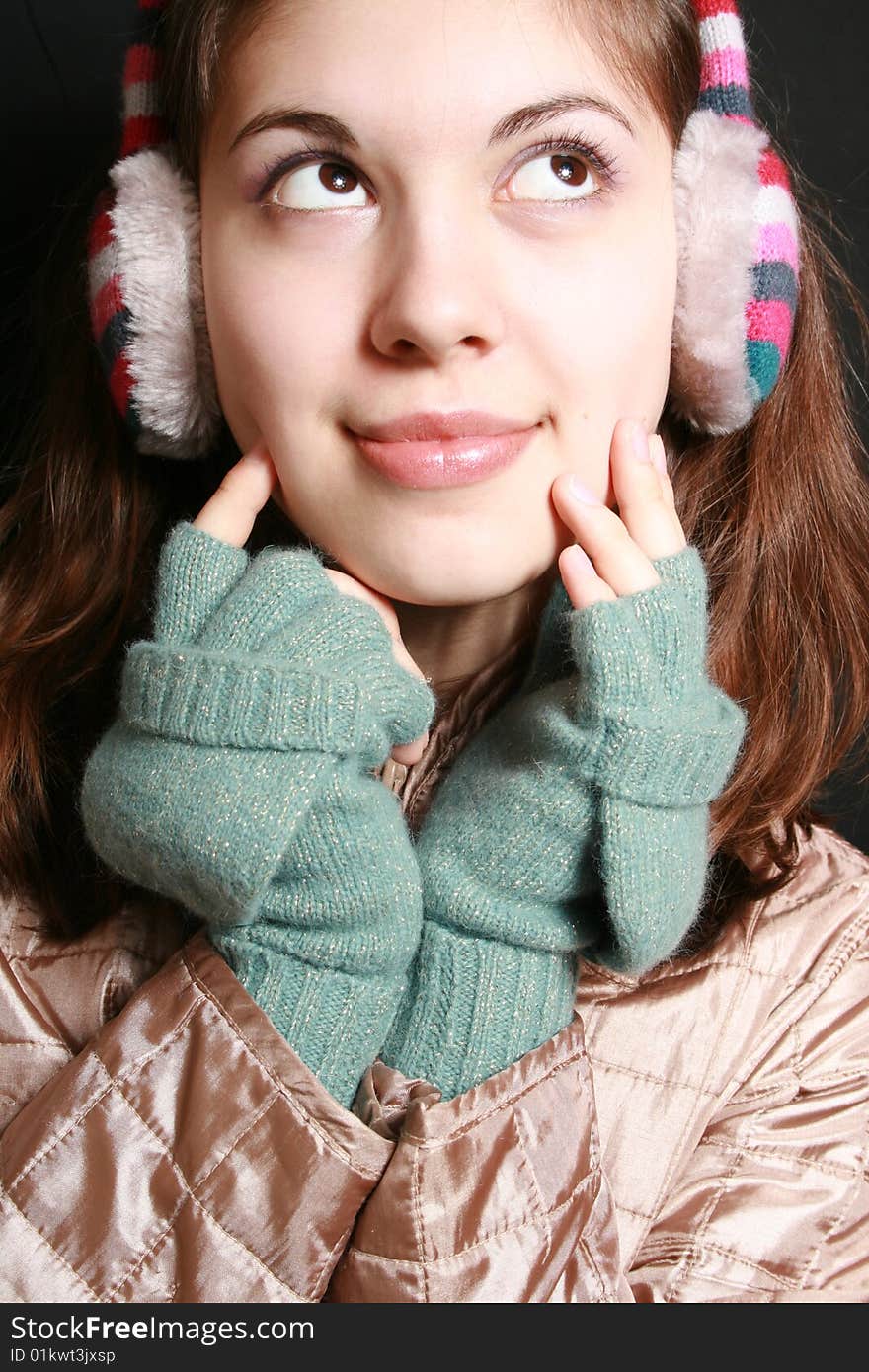 Portrait of the girl in striped headphones close up. Portrait of the girl in striped headphones close up.