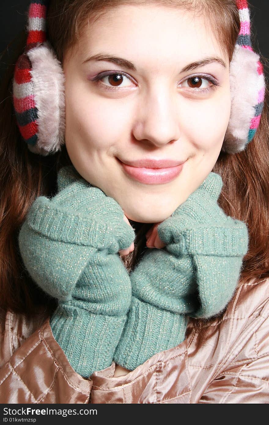 Portrait of the girl in striped headphones close up. Portrait of the girl in striped headphones close up.