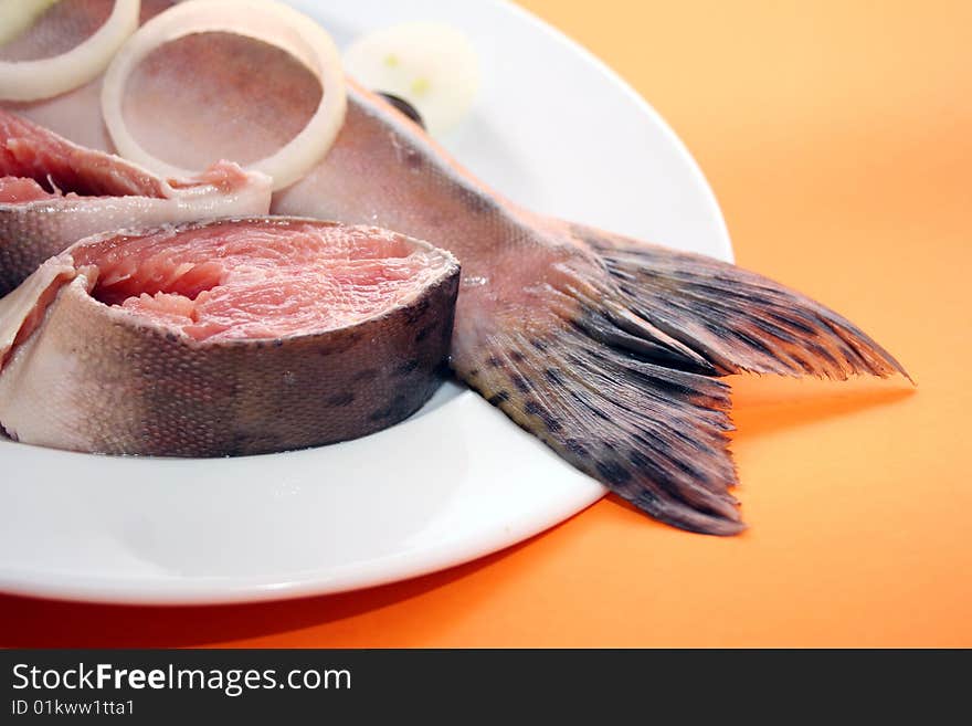 A fresh salmon and some salmon steaks. A fresh salmon and some salmon steaks